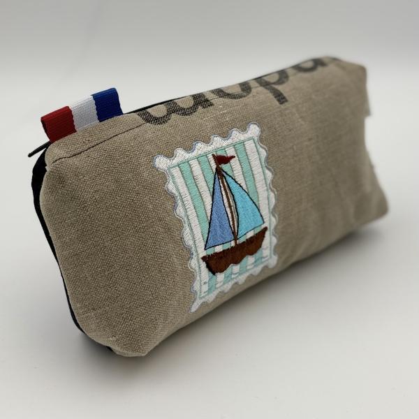 Toilettas van ptt postzak postzegel zeilboot