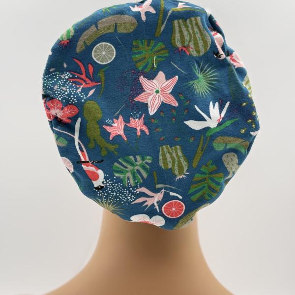 Handgemaakte chemo muts Buffy petrol met figuren en roze met bloemen maat M