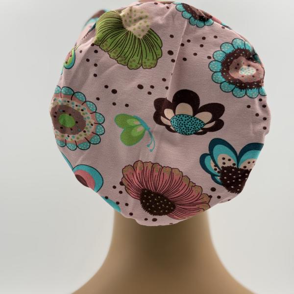 Handgemaakte chemo muts Buffy petrol met figuren en roze met bloemen maat M